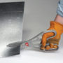 Worker with gloves cutting sheet metal with Malco's M12N Andy Snip