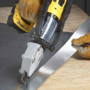 Person cutting a piece of sheet metal with a Malco TurboShear