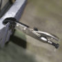Malco Axial Plier clamping together two pieces of welded metal.