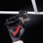 Man using Malco Ceiling Grid Punch on white grid