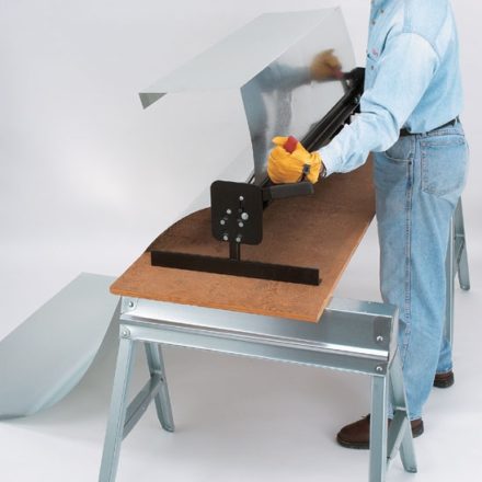 Man folding sheet metal with Malco's portable brake